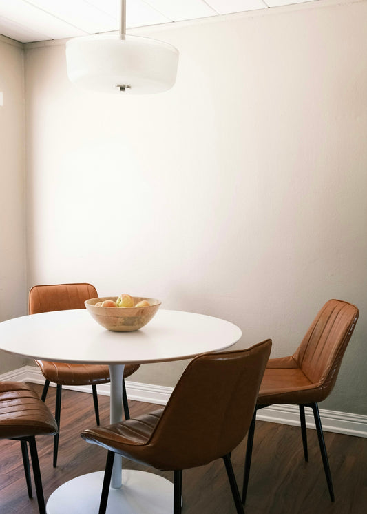 brown wooden round table with chairs