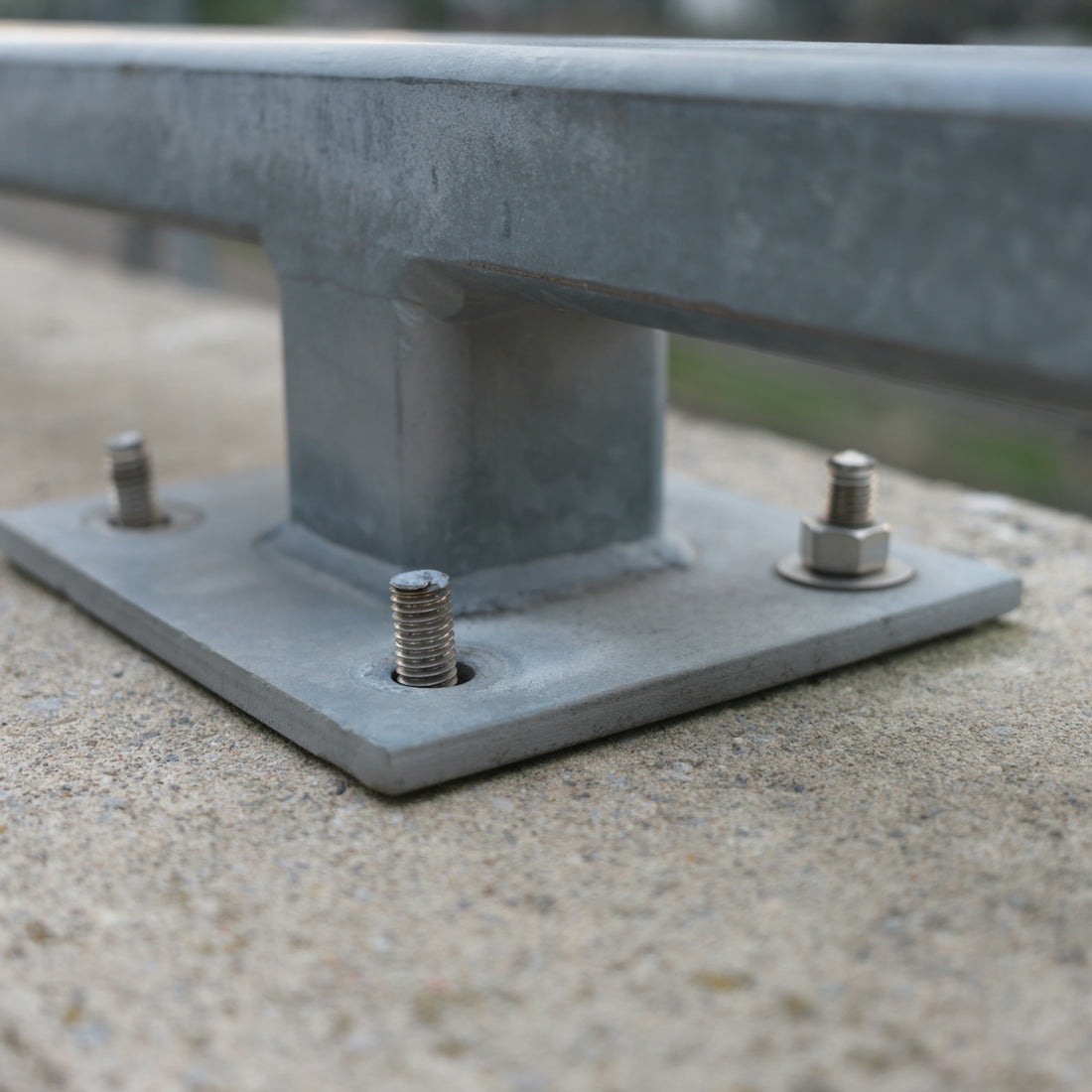 A close up of a metal object on a concrete surface